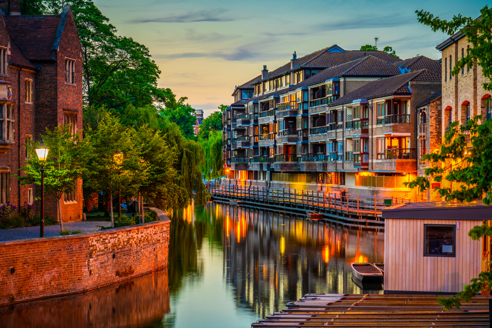 Cambridge's canal lit up at dusk.